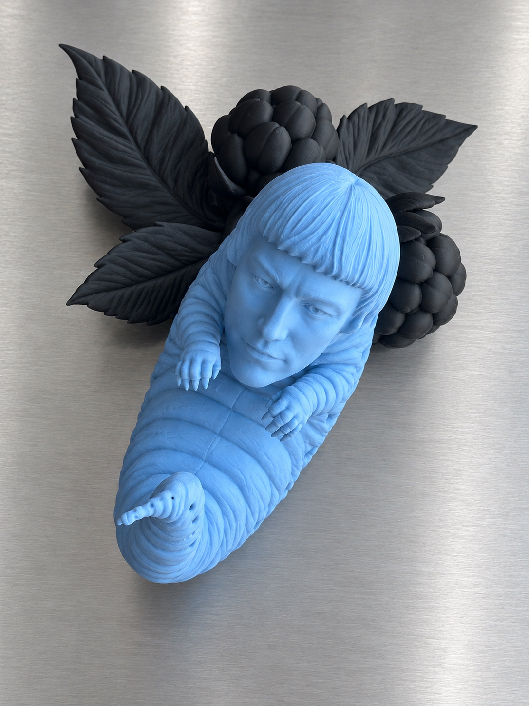 Larval self-portrait with black berries and leaves