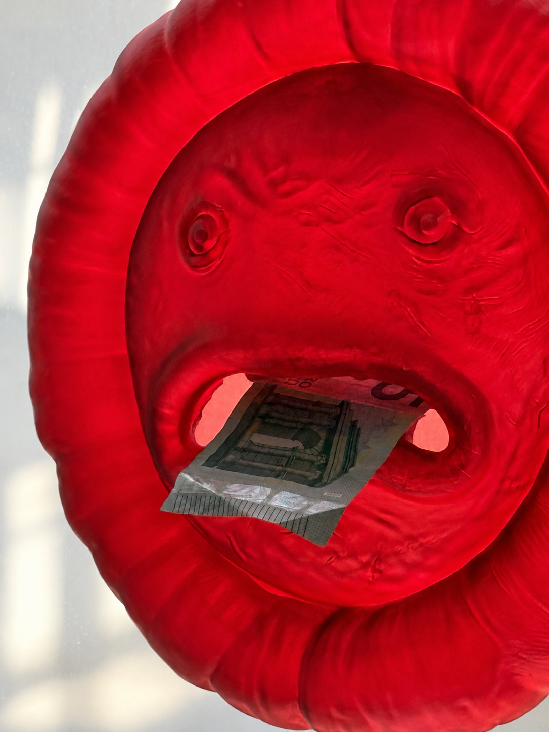 Close detail of Cashhole with a banknote