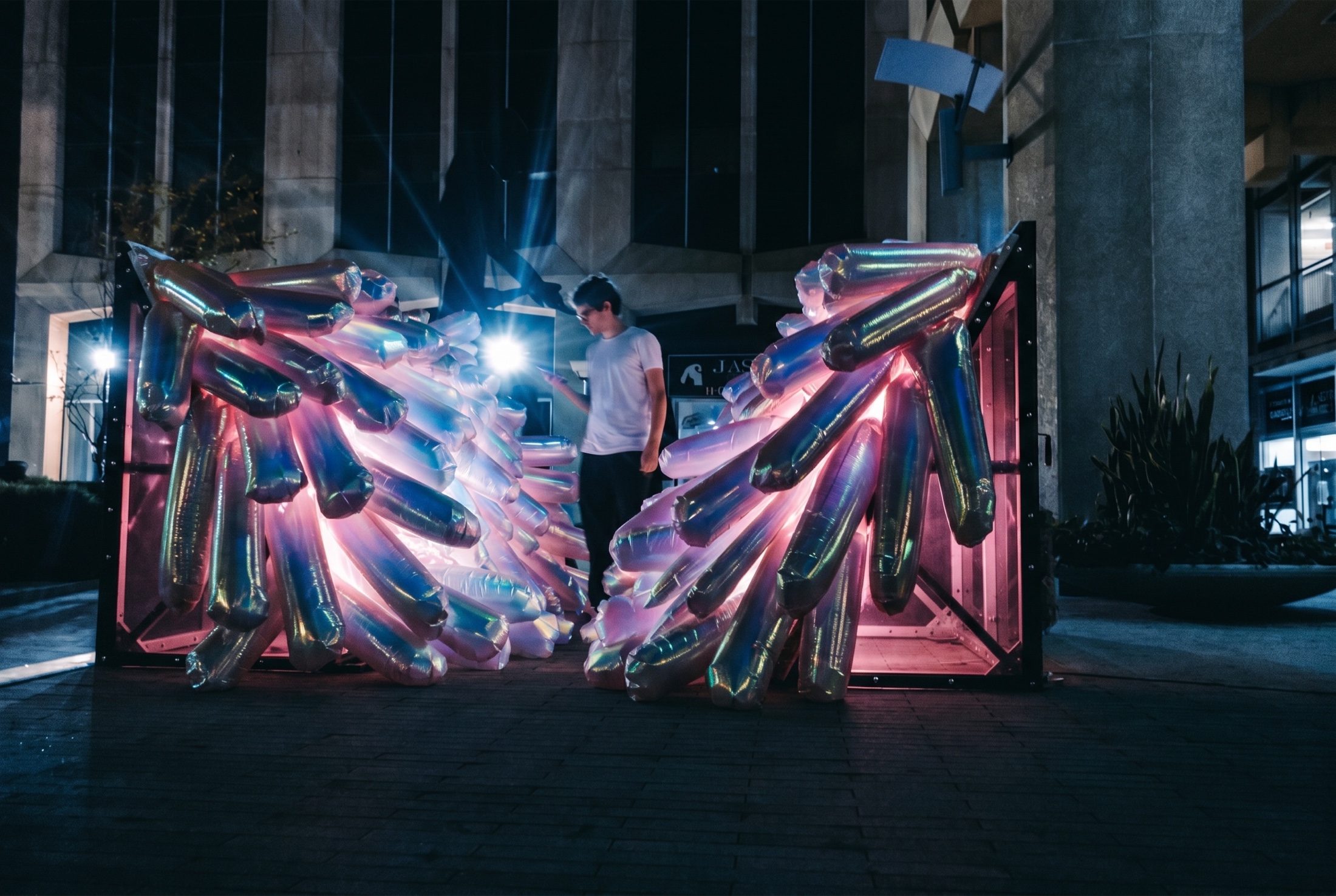 340 Tentacles interactive inflatable installation glowing at night with a visitor inside the tunnel