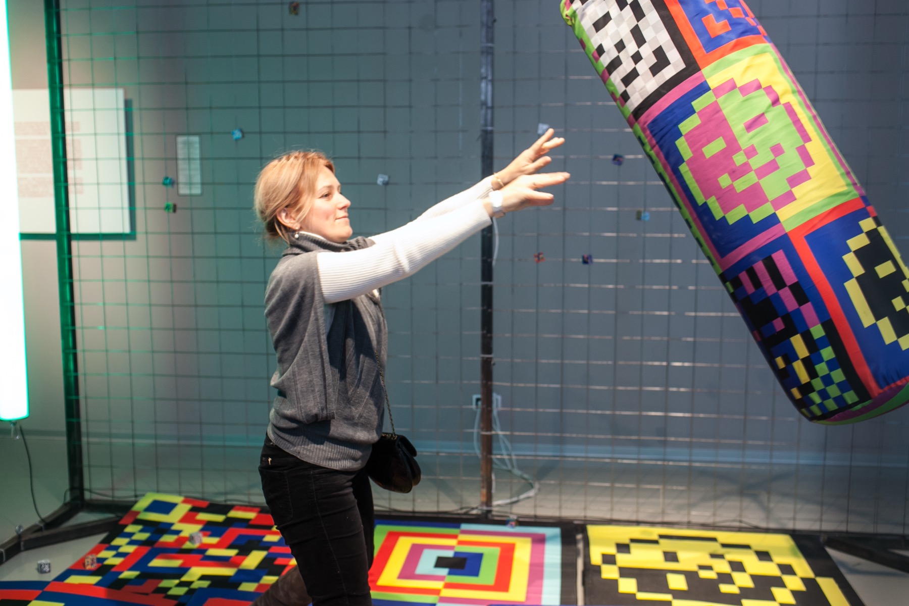 Visitor interacting with the punching bag in Ici on danse