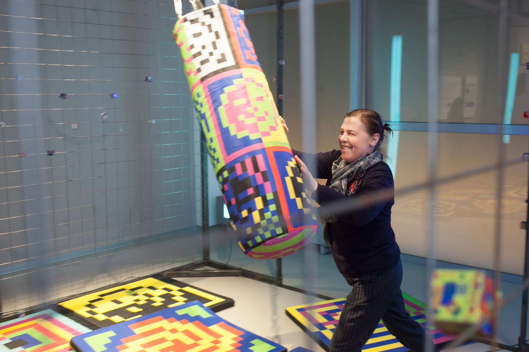 Visitor pushing the punching bag inside Ici on danse