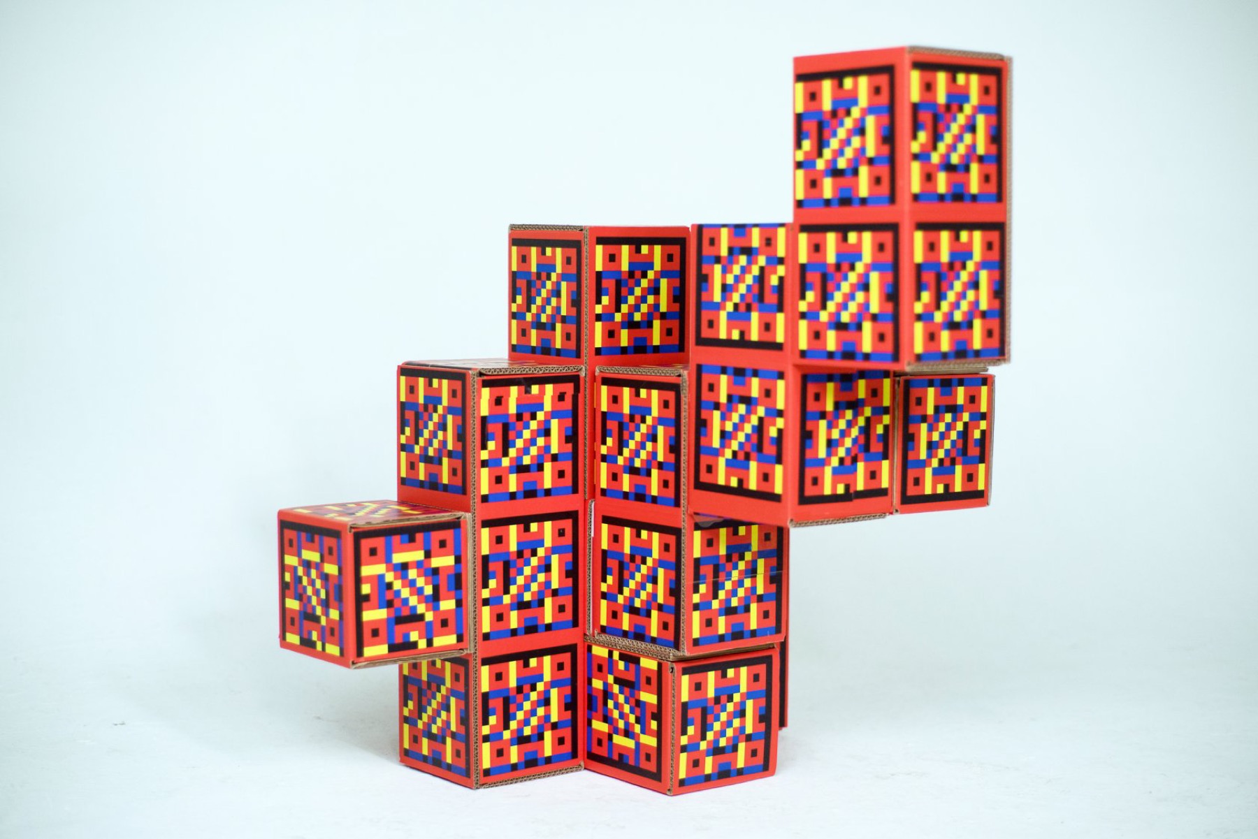 Red Pangan Tetris modules arranged as a stepped temporary sculpture