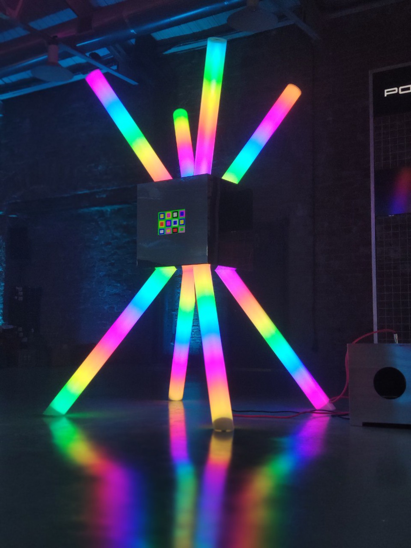 Compact POKE-N-CLICK light and sound installation with glowing tubes and reflective control box