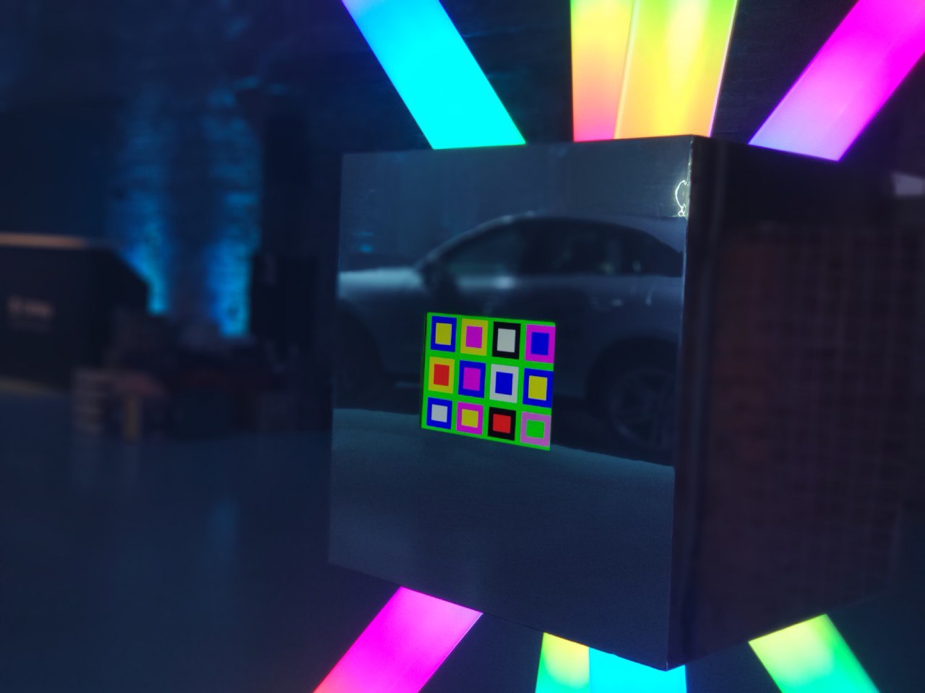 Close detail of compact POKE-N-CLICK reflective control surface and colored button panel