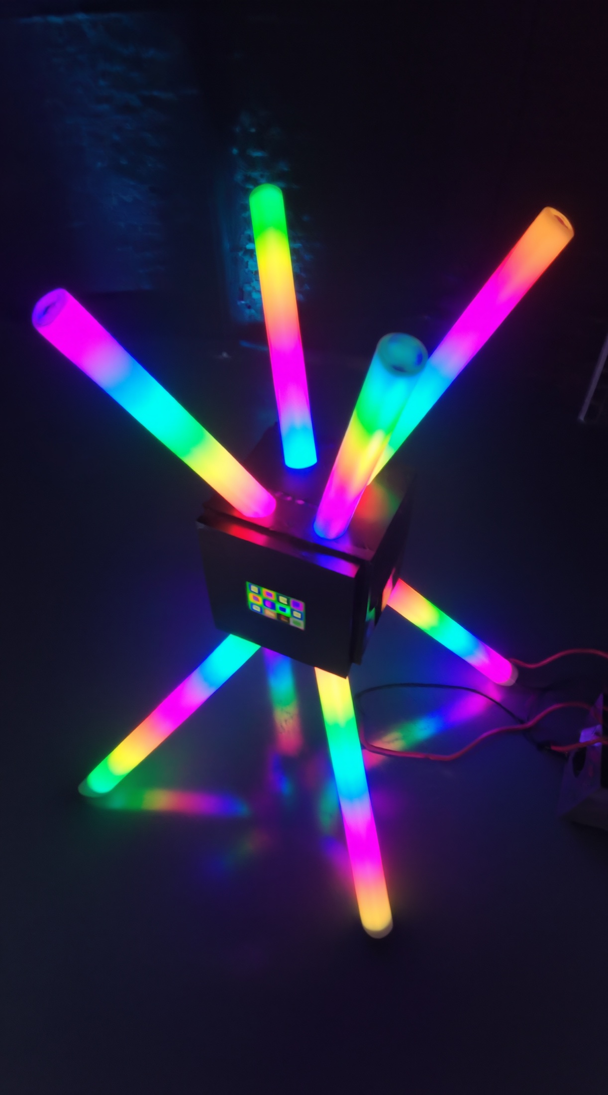 Compact POKE-N-CLICK glowing tube sculpture seen from above