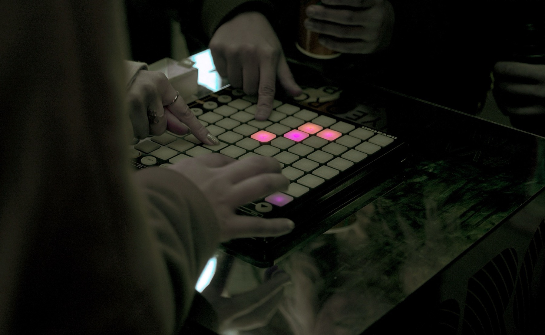 Visitors pressing a grid controller in POKE-N-CLICK