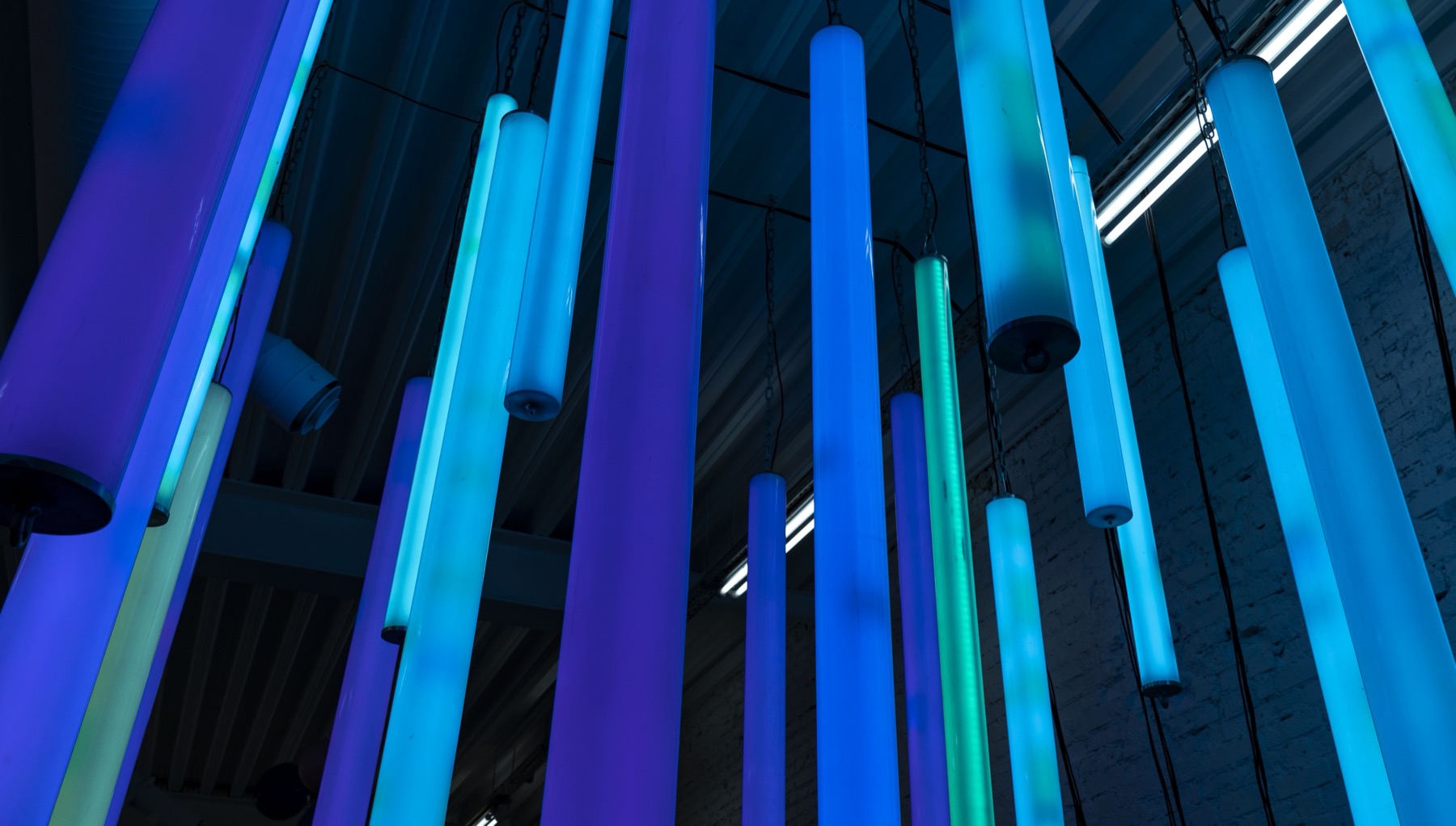 Close view of blue and green glowing lamps inside POKE-N-CLICK