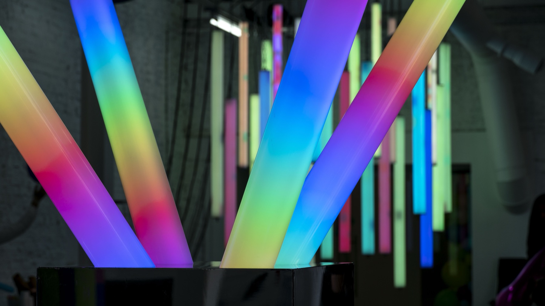 Close view of multicolored glowing tubes in POKE-N-CLICK