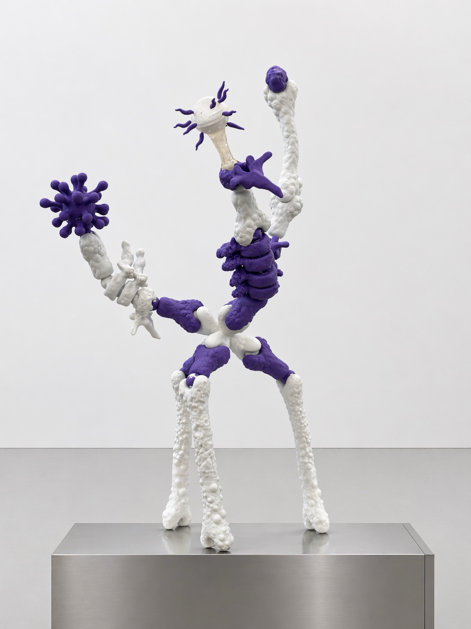 White and purple Rebone organizm'os standing organism on a metal plinth