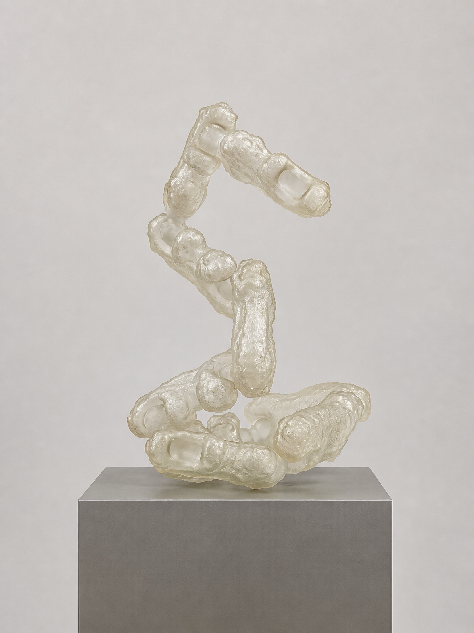 Translucent Rebone organizm’os structure standing on a metal plinth