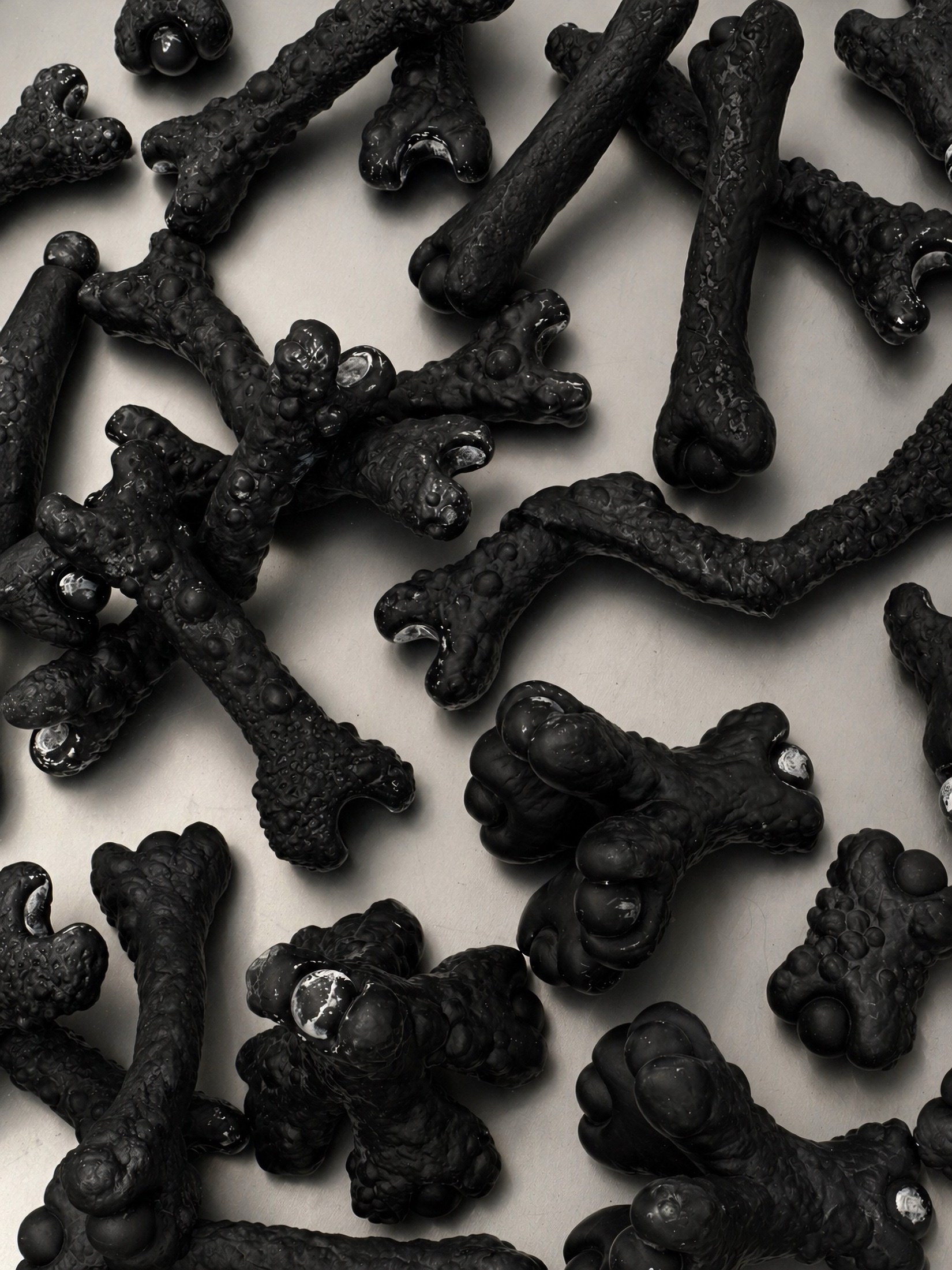 Black Rebone organizm'os components spread across a metal surface