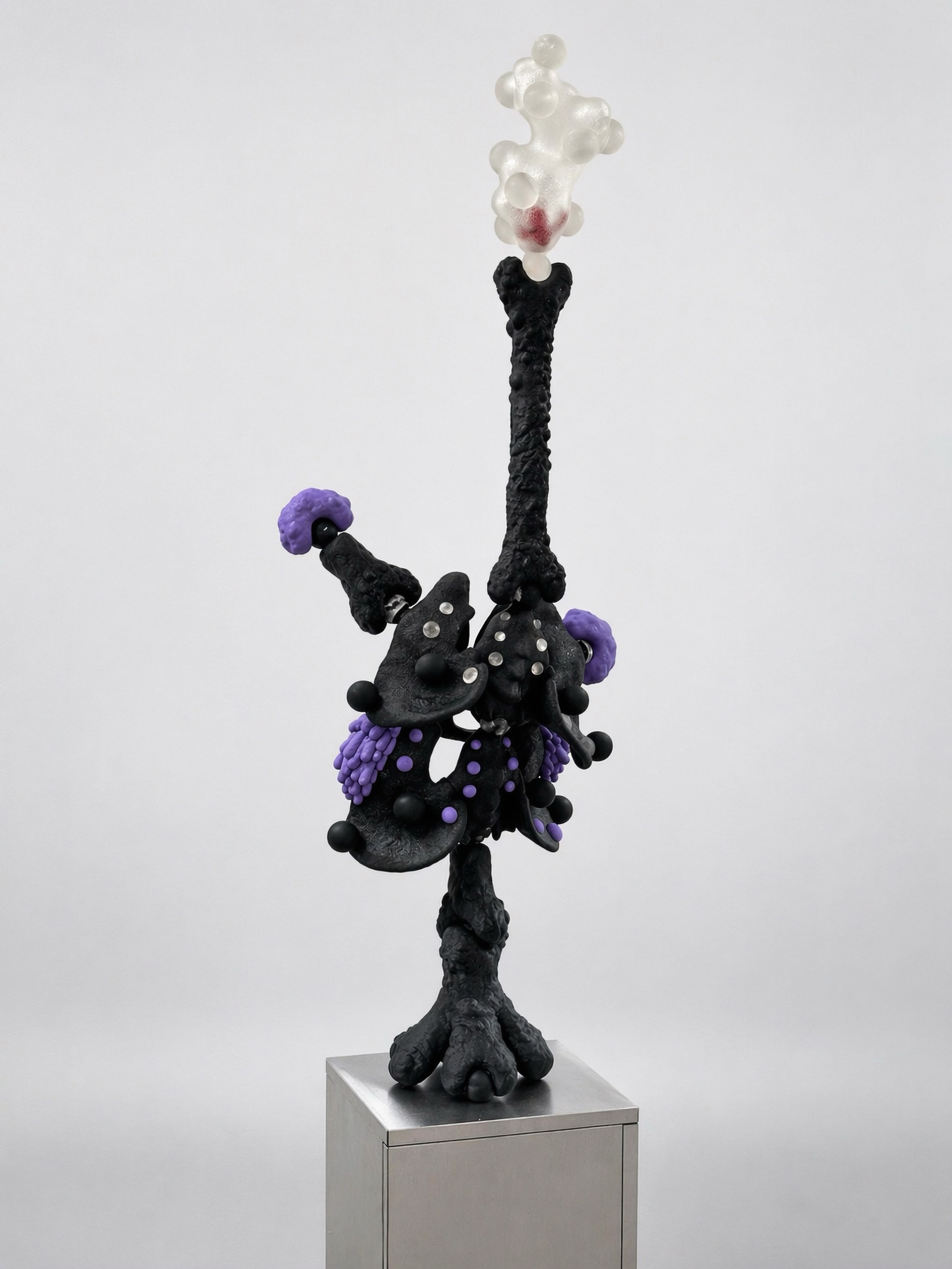 Tall black Rebone organizm'os structure with purple and translucent elements