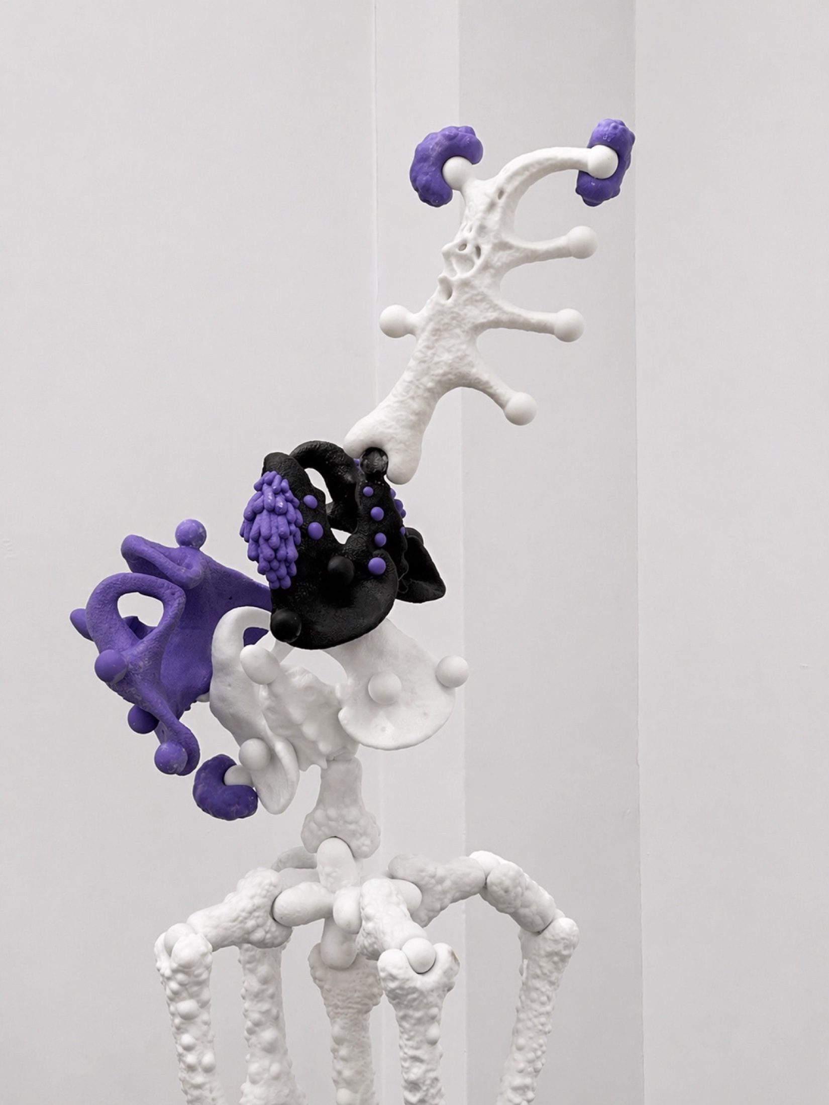 White and purple Rebone organizm'os vertical organism with black elements