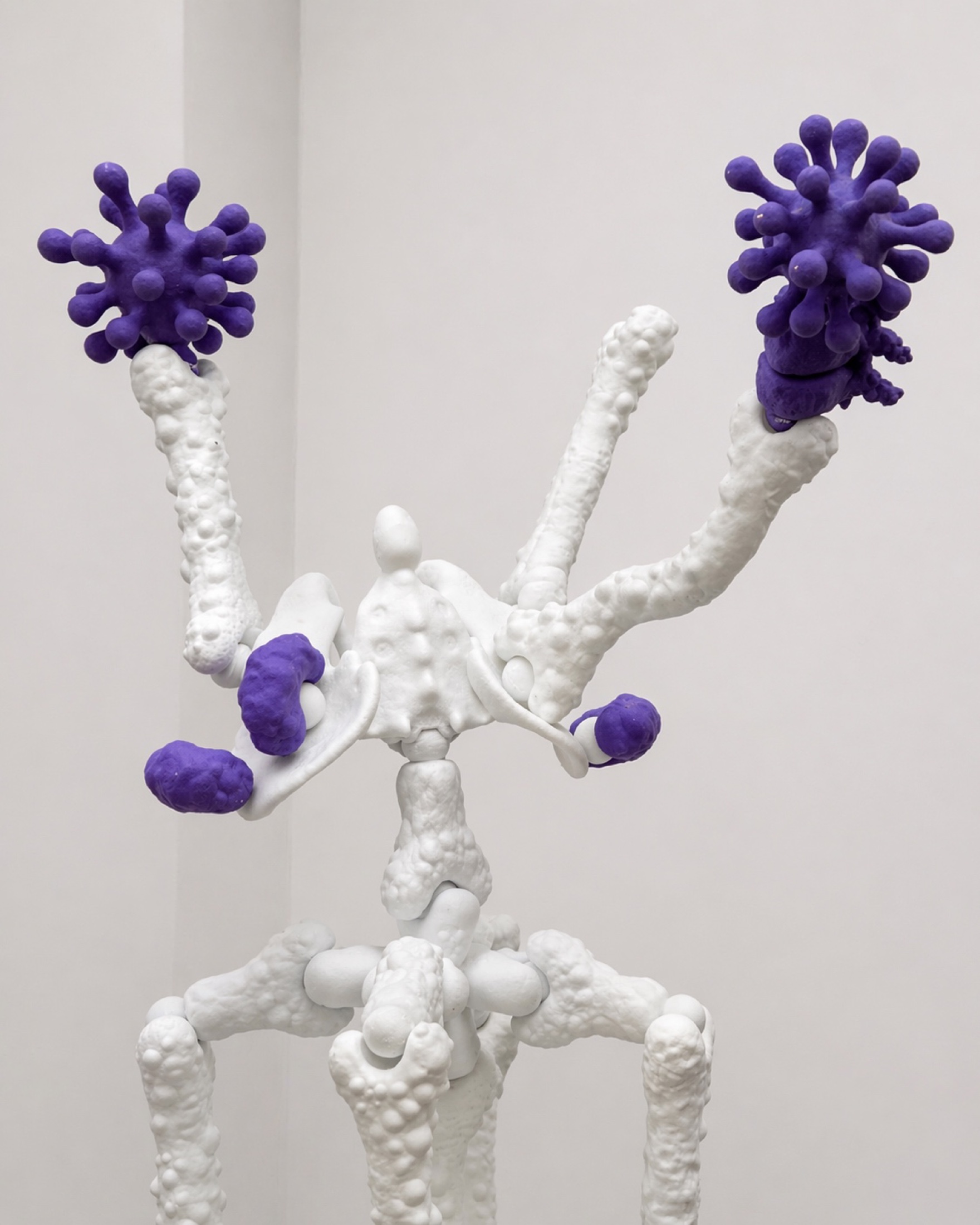 Close view of white Rebone organizm'os bones with purple virus-like elements